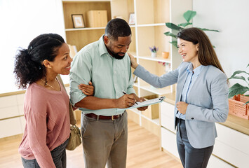 Female Real Estate Agent Selling Modern Apartment To His Young Clients , a couple signing agreement contract In The Fancy Apartment