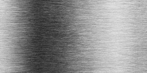 A close-up view of brushed metal, exhibiting a subtle, diagonal brushed texture