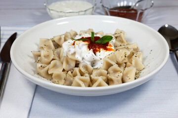 Mantı - Turkish ravioli pasta on wood concept	
