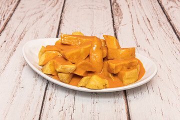 Standard fries served with a burger, presented on a stainless steel tray