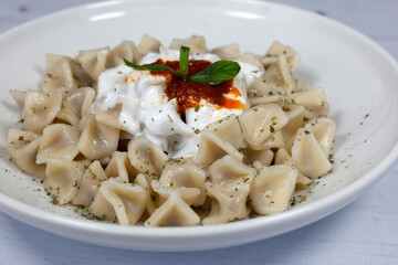 Mantı - Turkish ravioli pasta on wood concept	
