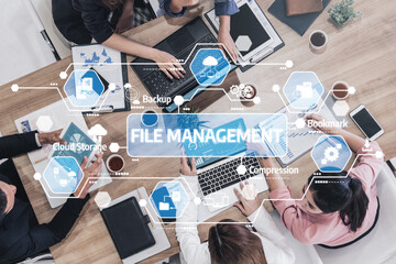 A professional team collaborates on innovative file management solutions using digital devices, emphasizing cloud storage and backup strategies for business efficiency. Tessel