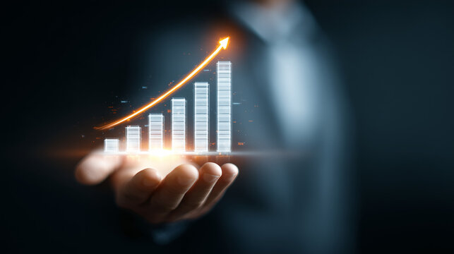 Business Professional Holding Glowing Upward Bar Chart Indicating Financial Growth

