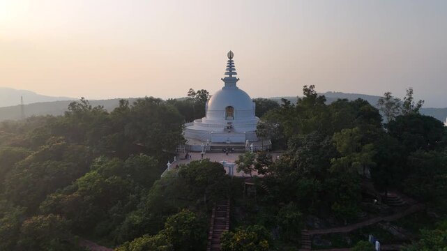 Vishwa Shanti Stupa in Rajgir, Bihar &ndash; a majestic white domed peace pagoda built by the Japanese, symbolizing global harmony, spirituality, and serenity, set atop scenic Ratnagiri hills.