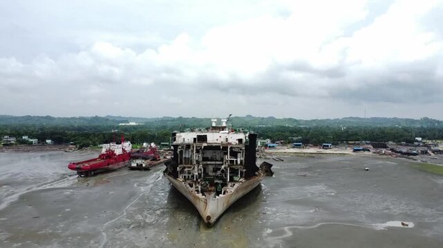 Aerial view of ship breaking yard in Chittagong, Bangladesh, showing large cargo ships dismantled for steel recycling and maritime industry