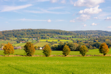 Obraz premium Autumn landscape, Terrain hilly countryside in Zuid-Limburg with a small villages on the hillside, farmland and forest, Epen is a village in southern part of the Dutch province of Limburg, Netherlands