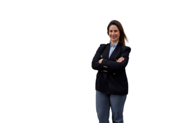 Businesswoman standing with crossed arms, smiling confidently, representing professionalism and success on a transparent background
