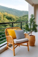 Fototapeta premium Balcony rattan chair with cushions overlooking mountains