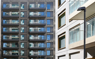 Modern multi-family housing complex features sustainable design green spaces. Residential buildings with balconies with urban landscape,  London, United Kingdom, 8 March 2025