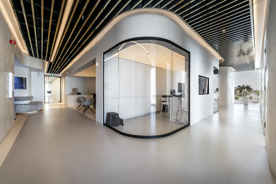 Modern dental office interior with reception desk, patient chairs, treatment rooms and professional equipment. Bright clean environment designed for healthcare and dentistry services, including x-ray 