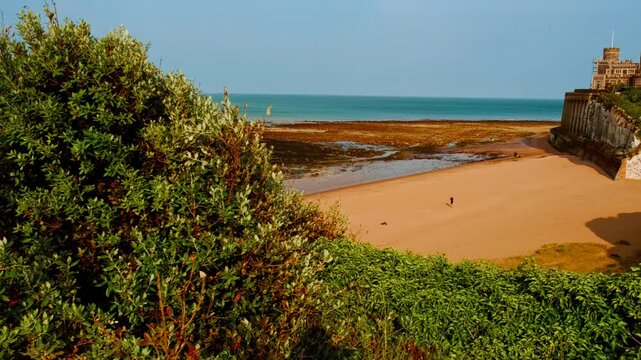 Kingsgate Bay beach and castle, Broadstairs, Kent, England, UK, with chalk cliffs, sandy cove and clifftop views