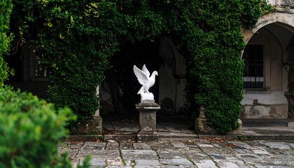 Statue of a Dove on Pedestal Beneath Lush Green Archway
