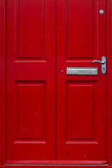 Colorful red door and the doorstep, the symbol of the city,  in the center of Dublin in Respublic Ireland