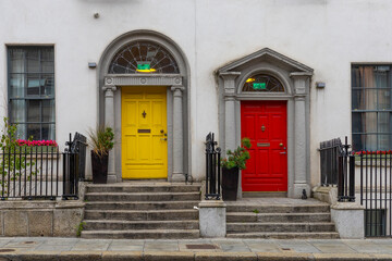 Naklejka premium Colorful doors and the doorstep, the symbol of the city, in the center of Dublin in Respublic Ireland