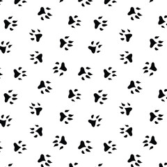 Seamless pattern with black dog pawprint on transparent background
