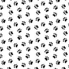 Seamless pattern with black cat pawprint on transparent background