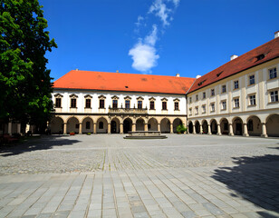 Fototapeta premium Palace Building Exterior with Sunny Blue Sky and Courtyard