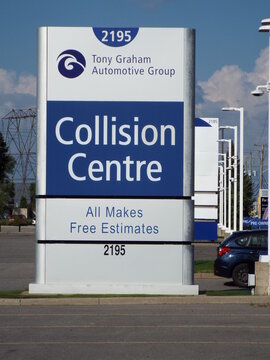 Ottawa, ON, Canada, June 20, 2025:A close-up of a modern, prominent roadside sign for  "Tony Graham Automotive Group Collision Centre" at 2195 Robertson Road.

