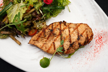 Grilled chicken fillet with salad