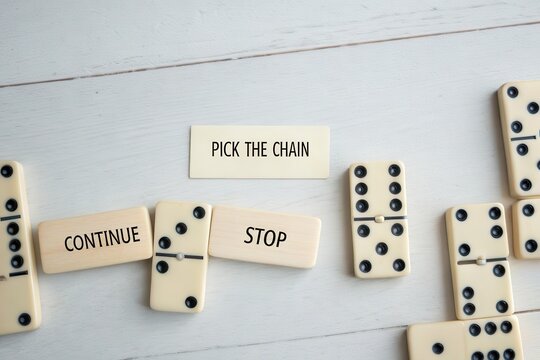 Dominoes arranged with chain and continue stop message