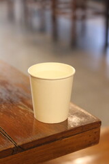 Paper cups placed on a wooden table