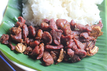 Fried pork with garlic and sticky rice