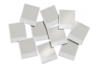 White instant photo frames scattered isolated on a transparent background