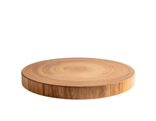 A round, wooden cutting board is isolated against a stark black background