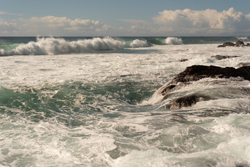 Surf breaking off Snapper Rocks, a popular surfing location at Coolangatta, Gold Coast, Queensland, Australia.