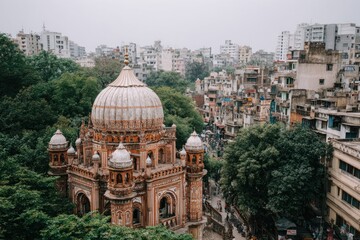 Ornate domed structure amidst dense foliage, contrasting with crowded city backdrop
