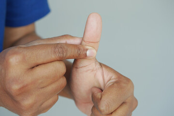 Hand demonstrating thumb flexion for flexibility exercises