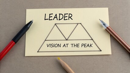 Leadership Concept with Vision at the Peak Illustrated on Sticky Note Surrounded by Writing Tools and Pens