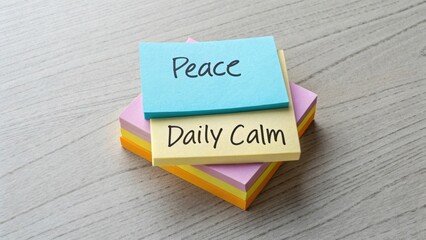 Colorful Sticky Notes on a Wooden Surface with Messages of Peace and Daily Calm for Inspirational Themes