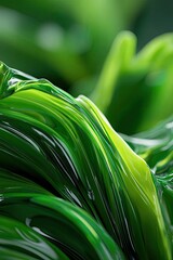 Green abstract glossy waves, close-up with light