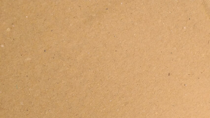 Old Kraft paper texture box craft stripes pattern. top view.
Abstract brown recycled paper background. 