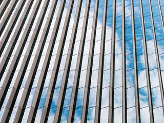 Glass wall Facade Stripe pattern Sky reflection Modern building exterior Architecture details Abstract background