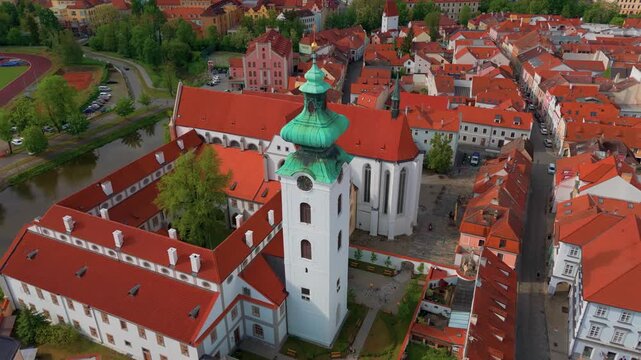 Aerial footage showcasing the historic Dominican Monastery and the picturesque old town of Česk&eacute; Budějovice, South Bohemia, Czech Republic, with its distinctive red tiled roofs and the iconic monaster