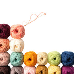 Colorful yarn balls stacked in various shades
