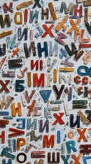 Chaotic, colorful letters arranged on a textured white wall