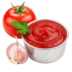 Red tomato sauce in a bowl, next to a whole tomato and garlic