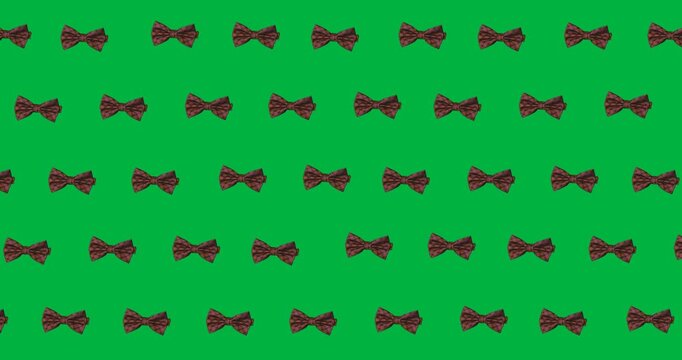 Multiple bow tie icons in seamless pattern against copy space on transparent background