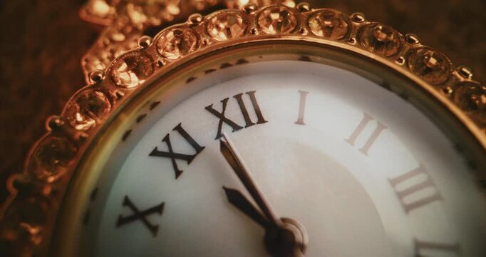 Close Up of Decorative Clock with Roman Numerals with Ornate Jeweled Frame Showing Time. Elegant and Stylish Design Symbolizing Punctuality, Tradition, Luxury Lifestyle, Symbolic Measurement of Time.