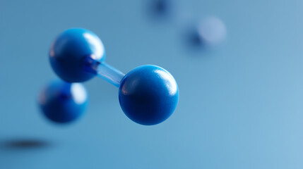 Close-up of blue molecular model spheres connected by transparent rods on a blue background, representing a chemical or scientific concept