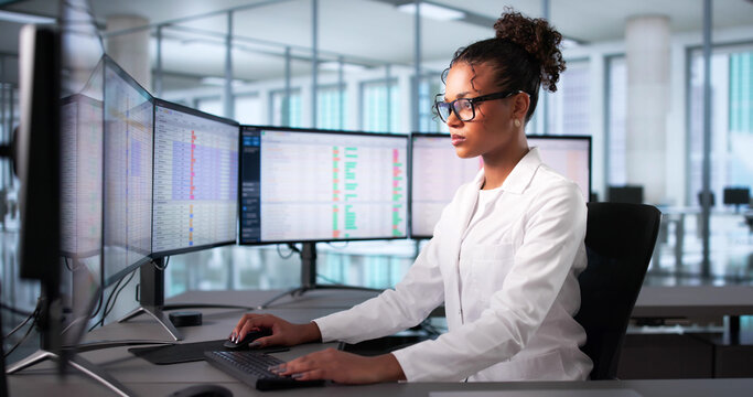 African American Woman Manages Medical Billing At Hospital