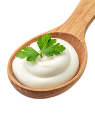Creamy sauce in a wooden spoon, topped with fresh parsley