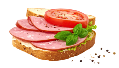 Two slices of bread sandwich with sliced ham, tomato, lettuce, and basil
