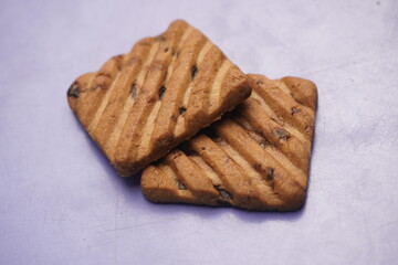 Hide and Seek chocolate biscuits are crunchy, delicious cookies loaded with rich chocolate chips, offering a perfect blend of sweetness and crunch