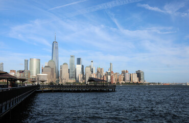 Breathtaking Manhattan New York skyline view from New Jersey showing pier and Hudson River water during daytime