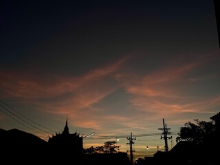 A serene evening atmosphere before sunset in Pak Phanang, Nakhon Si Thammarat, Thailand, captured on October 7, 2025, around 6 PM.