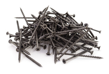 Black screws pile isolated on white background